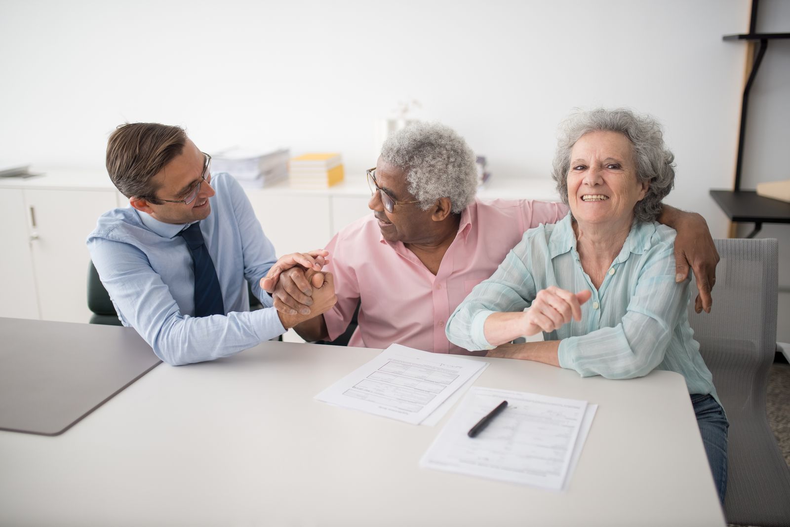 Stock photograph of an adviser meeting clients