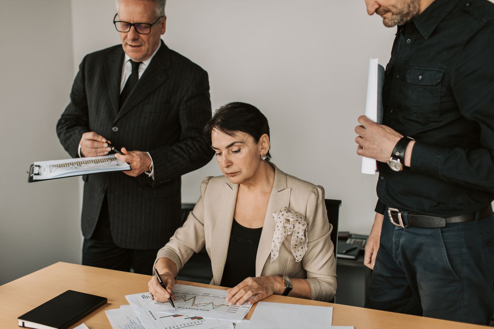 Illustrative business advisers reviewing accounts