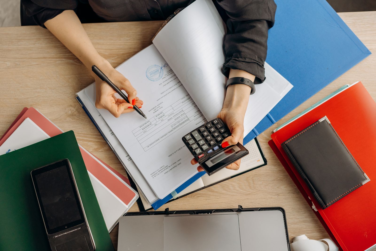 Stock photograph of financial records and a calculator