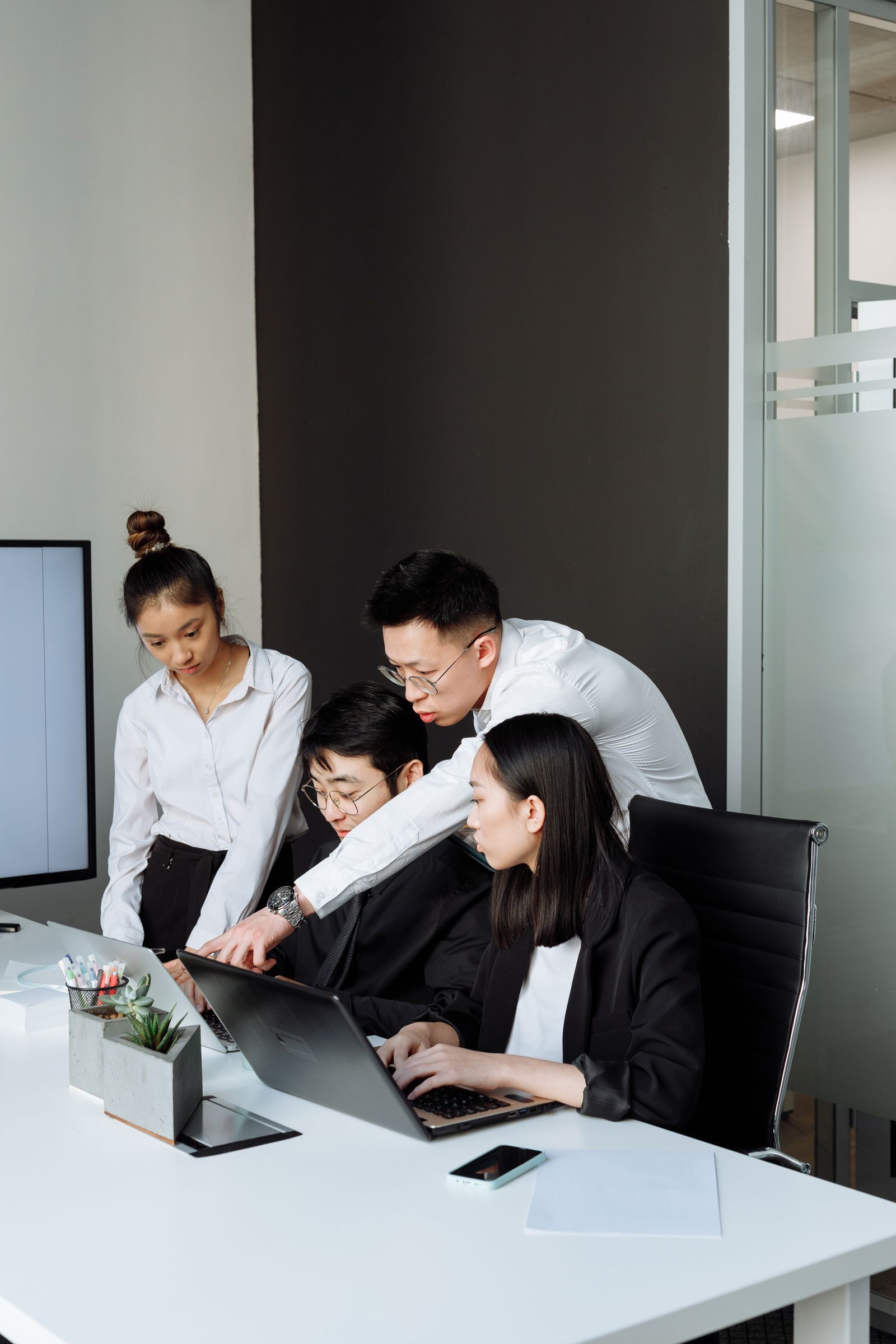 Professionals collaborating at an office desk